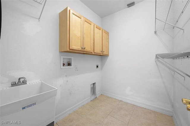 10310 Carolina Willow Dr, Fort Myers, FL 33913 - laundry room featuring hookup for a washing machine, electric dryer hookup, cabinet space, light tile patterned floors, and baseboards