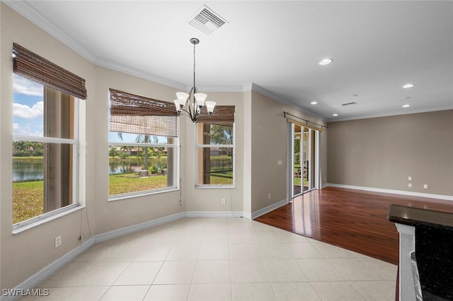 10310 Carolina Willow Dr, Fort Myers, FL 33913 - empty room with healthy amount of natural light, a water view, a chandelier, crown molding, and recessed lighting