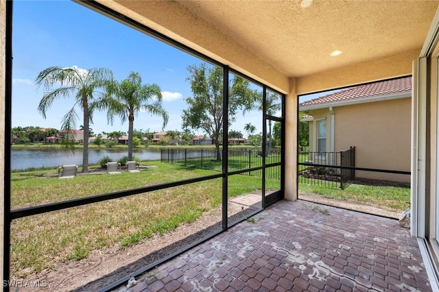 10310 Carolina Willow Dr, Fort Myers, FL 33913 - unfurnished sunroom featuring a water view