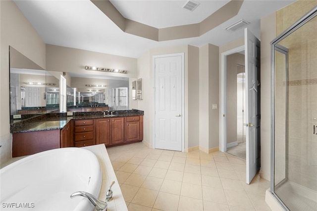 10310 Carolina Willow Dr, Fort Myers, FL 33913 - full bathroom with a stall shower, vanity, a garden tub, and tile patterned flooring