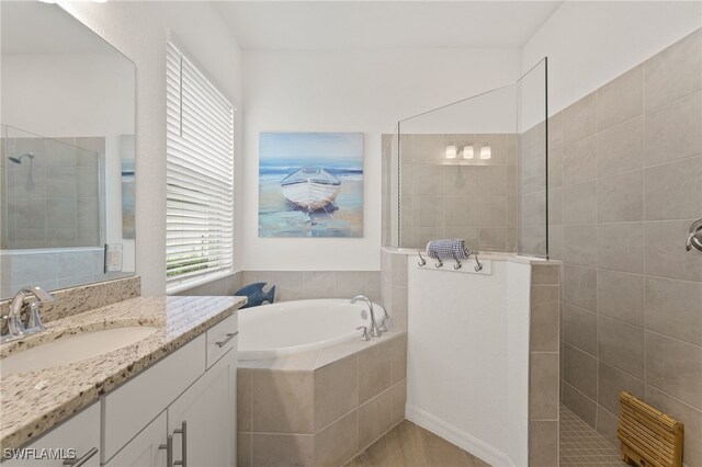 14860 Cherry Blossom Way, Punta Gorda, FL 33955 - full bath with a walk in shower, a garden tub, and vanity