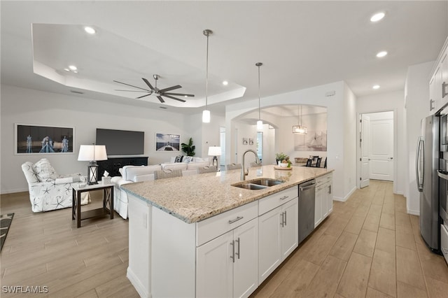 14860 Cherry Blossom Way, Punta Gorda, FL 33955 - kitchen with a sink, arched walkways, light wood-style floors, stainless steel dishwasher, and recessed lighting