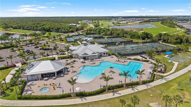 14860 Cherry Blossom Way, Punta Gorda, FL 33955 - bird's eye view of a pool, a nearby body of water, and a golf club