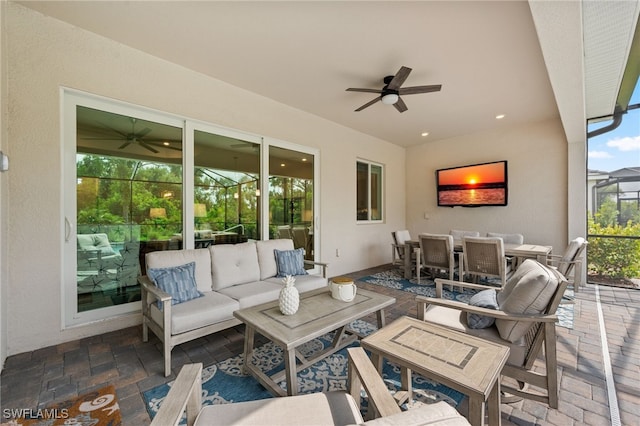14860 Cherry Blossom Way, Punta Gorda, FL 33955 - view of patio / terrace with an outdoor living space, outdoor dining area, a ceiling fan, and a lanai