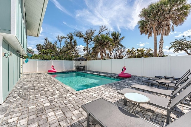 114 Lovers Ln, Fort Myers Beach, FL 33931 - view of pool featuring a patio and a fenced backyard