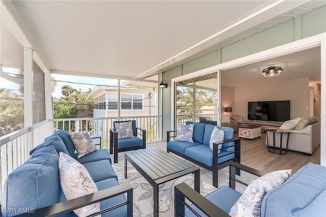 114 Lovers Ln, Fort Myers Beach, FL 33931 - sunroom featuring outdoor lounge area