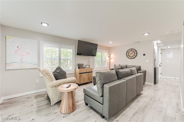 114 Lovers Ln, Fort Myers Beach, FL 33931 - living room featuring light wood-type flooring, baseboards, and recessed lighting