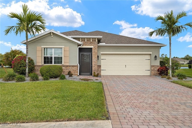 view of front of property with stone siding, stucco siding, a garage, and decorative driveway