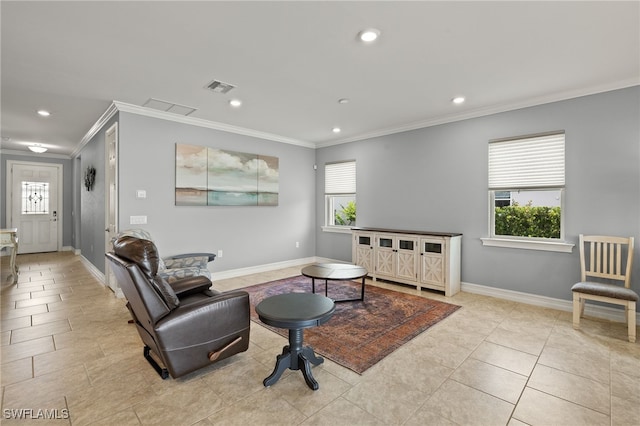 living room with ornamental molding, plenty of natural light, recessed lighting, and baseboards