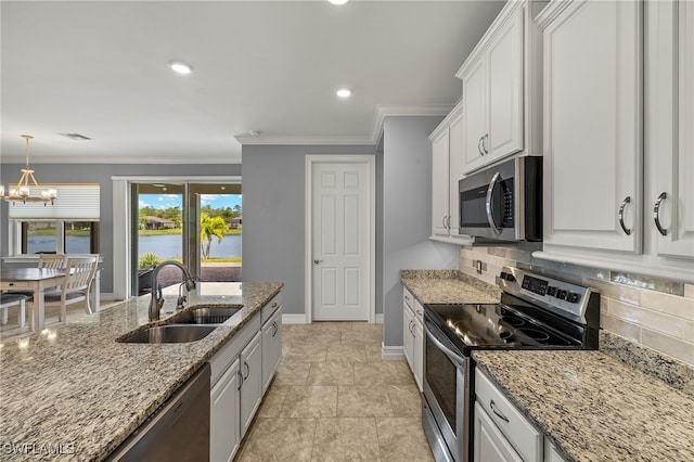 kitchen featuring stainless steel appliances, a sink, decorative backsplash, white cabinetry, and light stone counters
