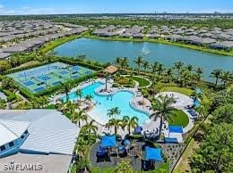bird's eye view of a pool and a nearby body of water