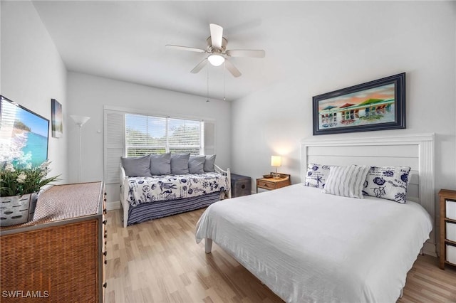 bedroom featuring light wood-style flooring and a ceiling fan