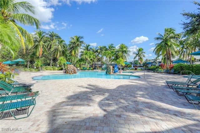 community pool with a patio area