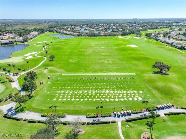 aerial view of residential area with a nearby body of water and a golf club