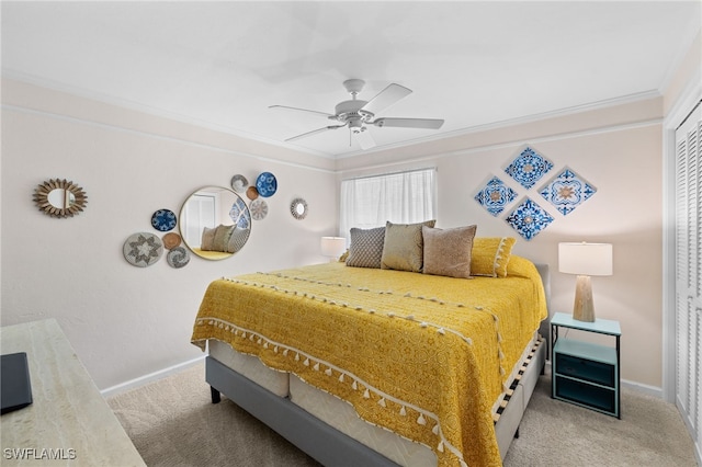 bedroom featuring carpet flooring, baseboards, crown molding, and a ceiling fan