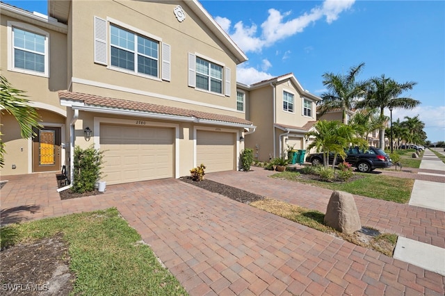 2780 Blossom Way, Naples, FL 34120 - multi unit property with driveway, stucco siding, and a garage