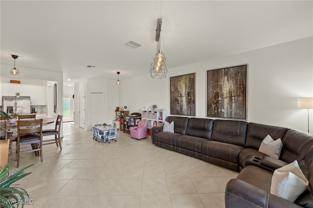 2780 Blossom Way, Naples, FL 34120 - living room featuring light tile patterned floors