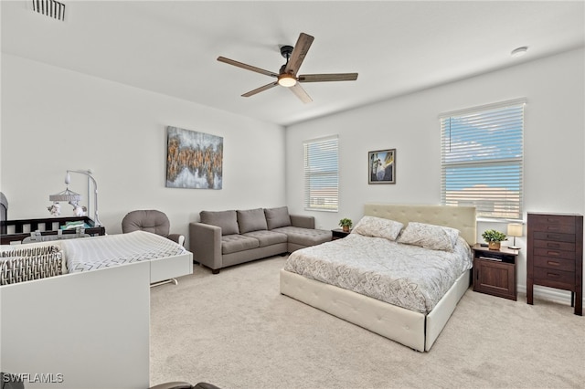 2780 Blossom Way, Naples, FL 34120 - bedroom with light carpet and a ceiling fan
