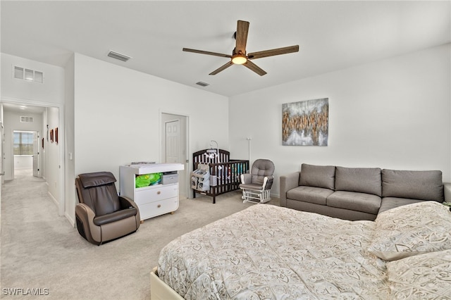 2780 Blossom Way, Naples, FL 34120 - bedroom with light colored carpet and ceiling fan