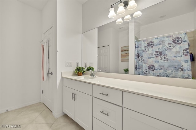 2780 Blossom Way, Naples, FL 34120 - full bath with tile patterned flooring, vanity, curtained shower, and baseboards