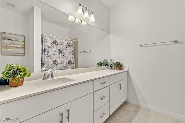 2780 Blossom Way, Naples, FL 34120 - bathroom featuring baseboards, vanity, tile patterned flooring, and curtained shower