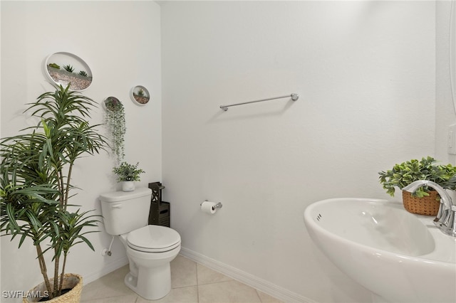 2780 Blossom Way, Naples, FL 34120 - half bathroom featuring a sink, toilet, tile patterned floors, and baseboards