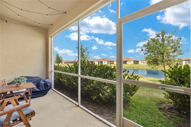 2780 Blossom Way, Naples, FL 34120 - sunroom featuring a water view and a residential view