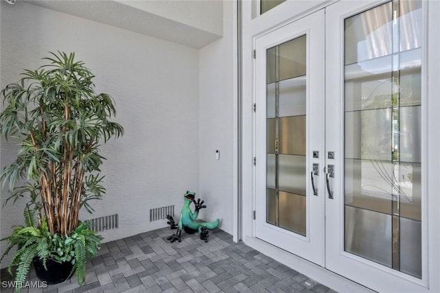 1428 SW 52nd Ln, Cape Coral, FL 33914 - doorway to property with french doors and stucco siding