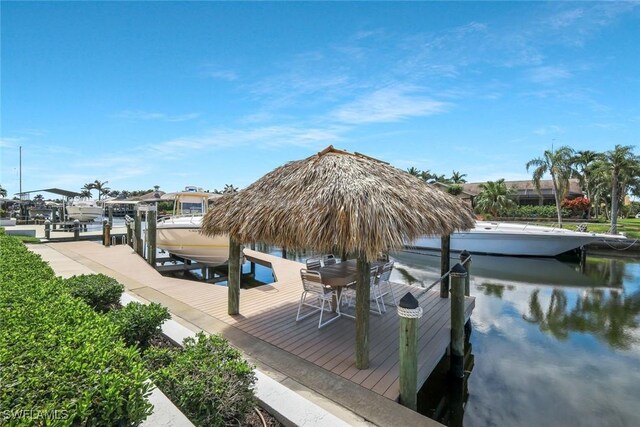 1428 SW 52nd Ln, Cape Coral, FL 33914 - dock featuring boat lift and a water view