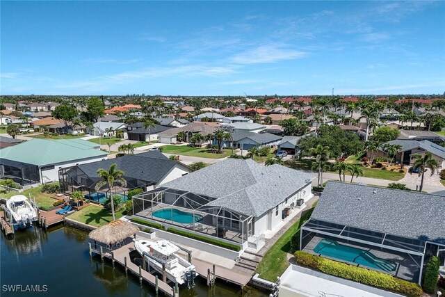 1428 SW 52nd Ln, Cape Coral, FL 33914 - aerial perspective of suburban area featuring a nearby body of water and a pool
