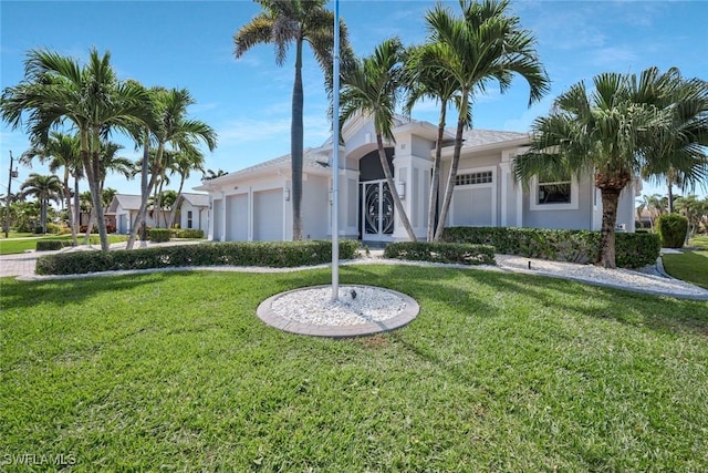 1428 SW 52nd Ln, Cape Coral, FL 33914 - ranch-style home featuring an attached garage, stucco siding, and a front yard