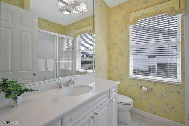 1428 SW 52nd Ln, Cape Coral, FL 33914 - full bathroom featuring wallpapered walls, tile patterned flooring, vanity, a stall shower, and toilet