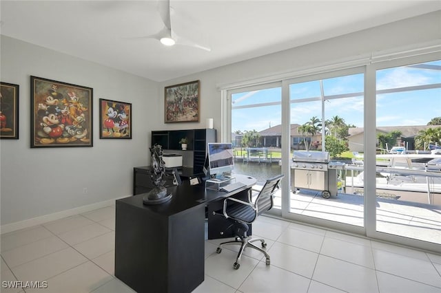 1428 SW 52nd Ln, Cape Coral, FL 33914 - office area featuring a ceiling fan, light tile patterned floors, and baseboards