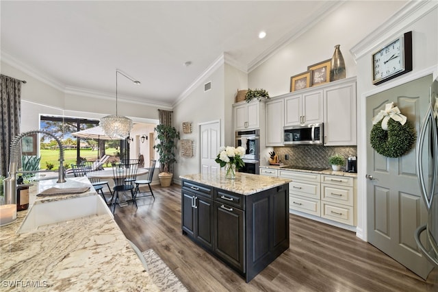 11730 Rosemount Dr, Fort Myers, FL 33913 - kitchen featuring stainless steel appliances, a sink, ornamental molding, white cabinetry, and dark wood-style floors
