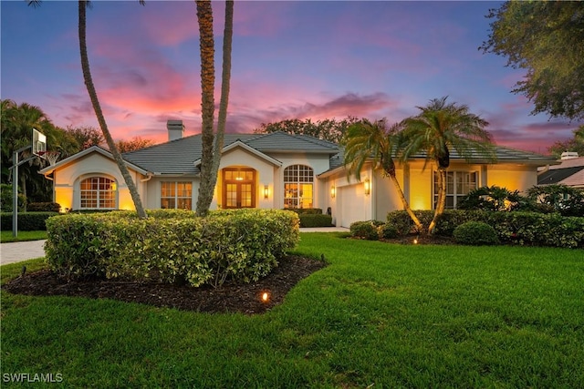 11730 Rosemount Dr, Fort Myers, FL 33913 - single story home with a garage, a front yard, a chimney, stucco siding, and a tile roof