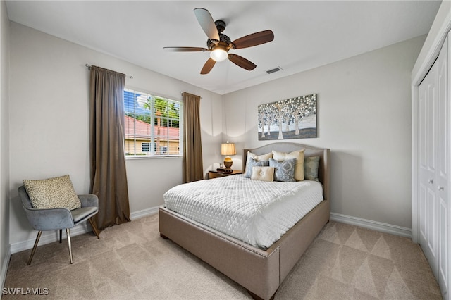 11730 Rosemount Dr, Fort Myers, FL 33913 - bedroom featuring a closet, light carpet, baseboards, and ceiling fan
