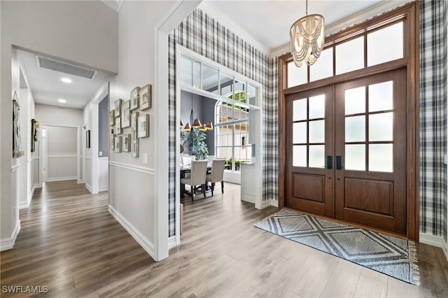 11730 Rosemount Dr, Fort Myers, FL 33913 - entryway with a chandelier, french doors, wood finished floors, and baseboards