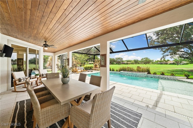 11730 Rosemount Dr, Fort Myers, FL 33913 - view of patio / terrace featuring an outdoor pool, a ceiling fan, a jacuzzi, outdoor dining space, and a lanai