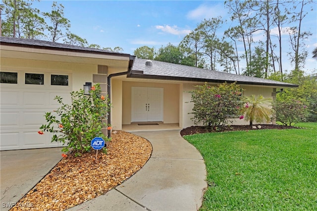 24410 Mountain View Dr, Bonita Springs, FL 34135 - doorway to property featuring a yard, stucco siding, a garage, and a shingled roof