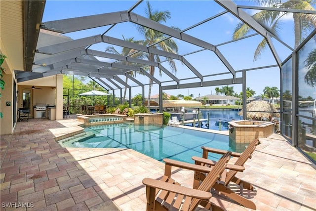2227 SW 54th Ln, Cape Coral, FL 33914 - view of pool with a pool with connected hot tub, a patio, grilling area, and a lanai