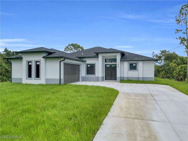 1432 Euclid Ave, Lehigh Acres, FL 33972 - prairie-style home with stucco siding, a garage, and a front lawn