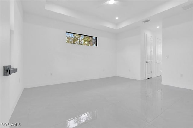 1432 Euclid Ave, Lehigh Acres, FL 33972 - unfurnished room featuring a tray ceiling and recessed lighting