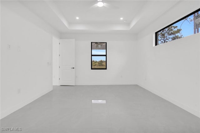 1432 Euclid Ave, Lehigh Acres, FL 33972 - spare room featuring a tray ceiling, ceiling fan, and recessed lighting