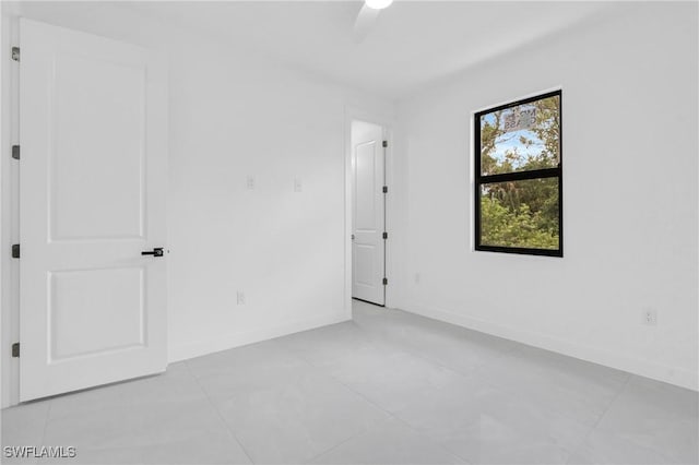 1432 Euclid Ave, Lehigh Acres, FL 33972 - spare room with a ceiling fan and light tile patterned flooring