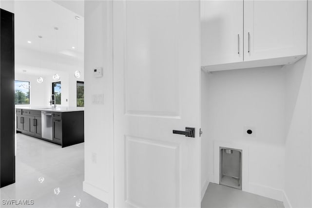 1432 Euclid Ave, Lehigh Acres, FL 33972 - laundry area featuring cabinet space, electric dryer hookup, and recessed lighting