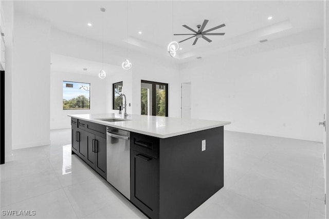 1432 Euclid Ave, Lehigh Acres, FL 33972 - kitchen with stainless steel dishwasher, dark cabinetry, a raised ceiling, light countertops, and recessed lighting