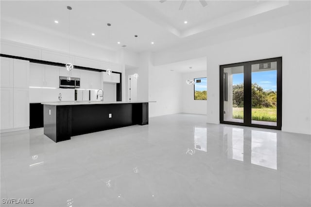 1432 Euclid Ave, Lehigh Acres, FL 33972 - unfurnished living room with a high ceiling, recessed lighting, and light tile patterned flooring