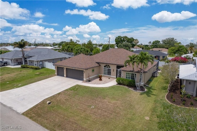 view of front of property with a garage, driveway, a residential view, stucco siding, and roof with shingles
