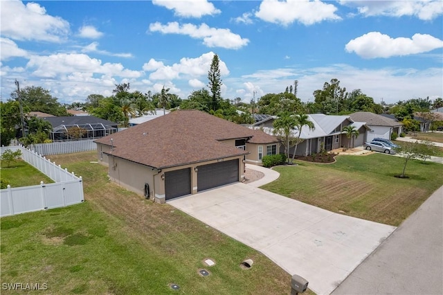 view of front of home featuring an attached garage, driveway, a residential view, and roof with shingles