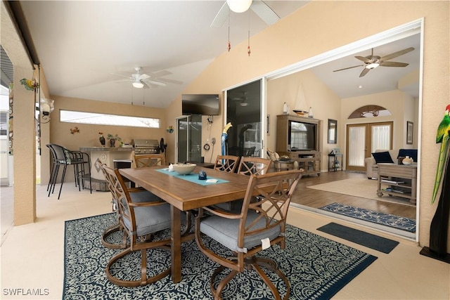 dining space featuring vaulted ceiling and ceiling fan